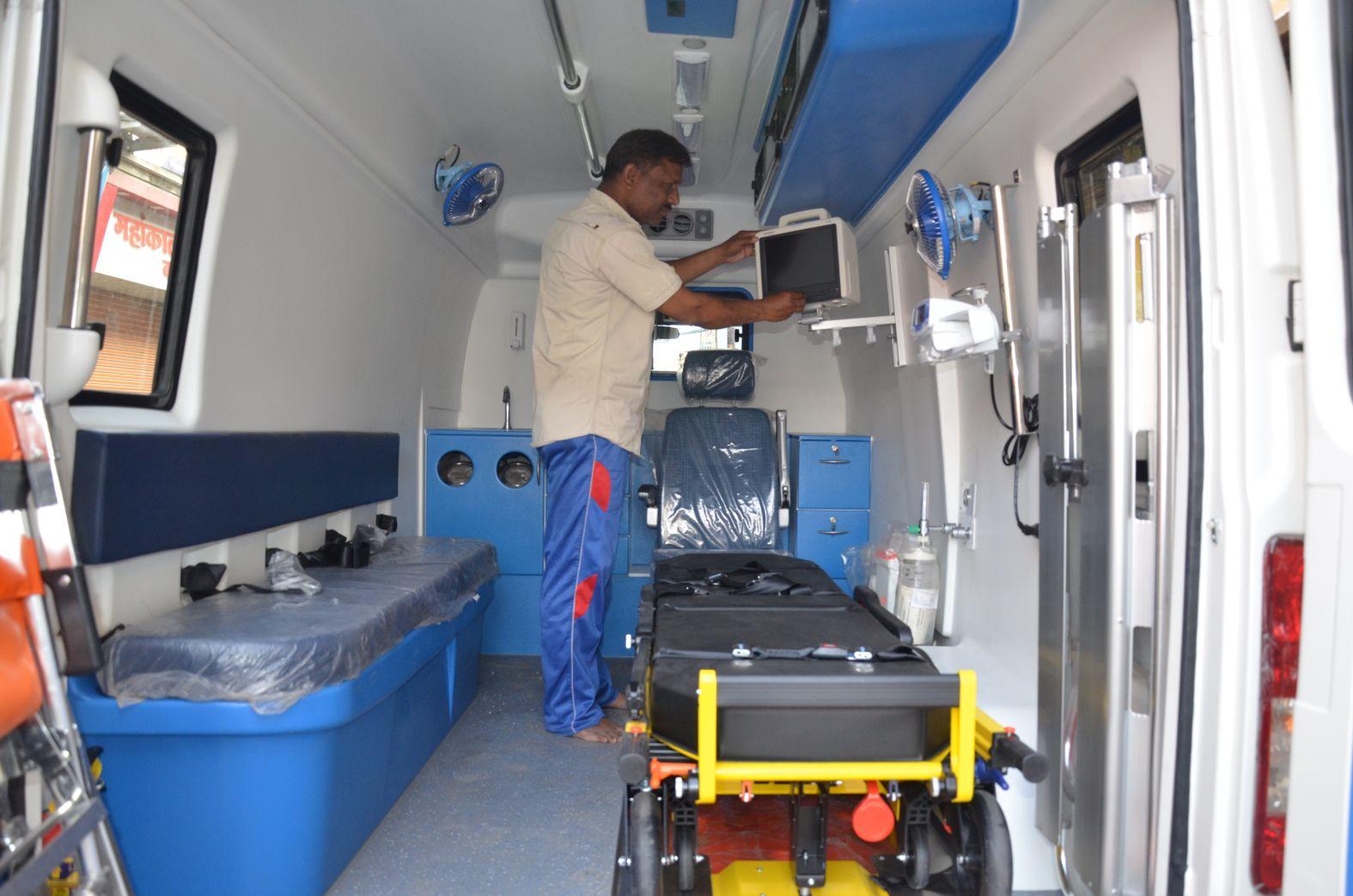 Employees preparing the ambulance before the demarcation