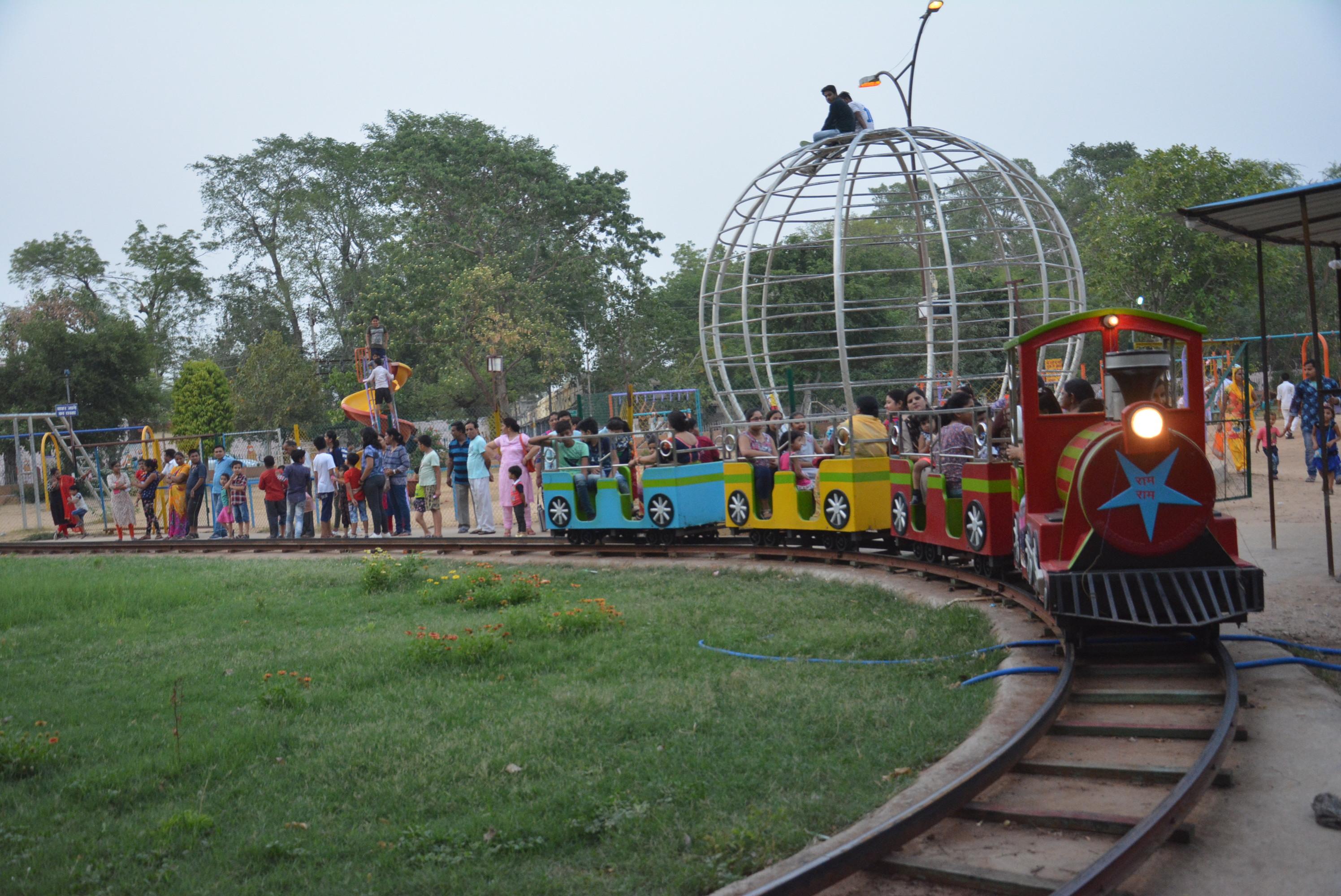Kids enjoying on toy train at nehru garden in alwar