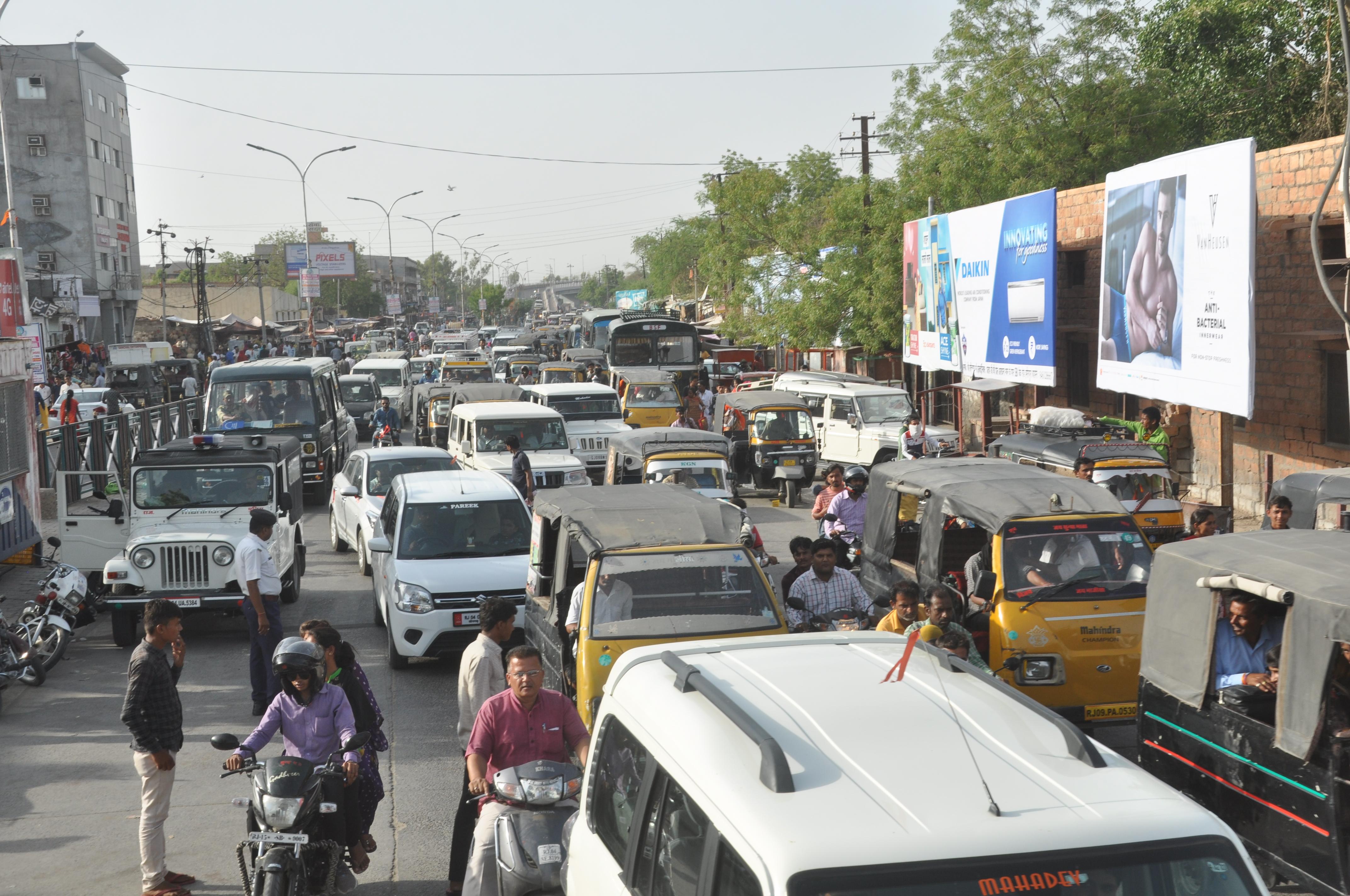 Disrupted city traffic system, long lines of vehicles engaged