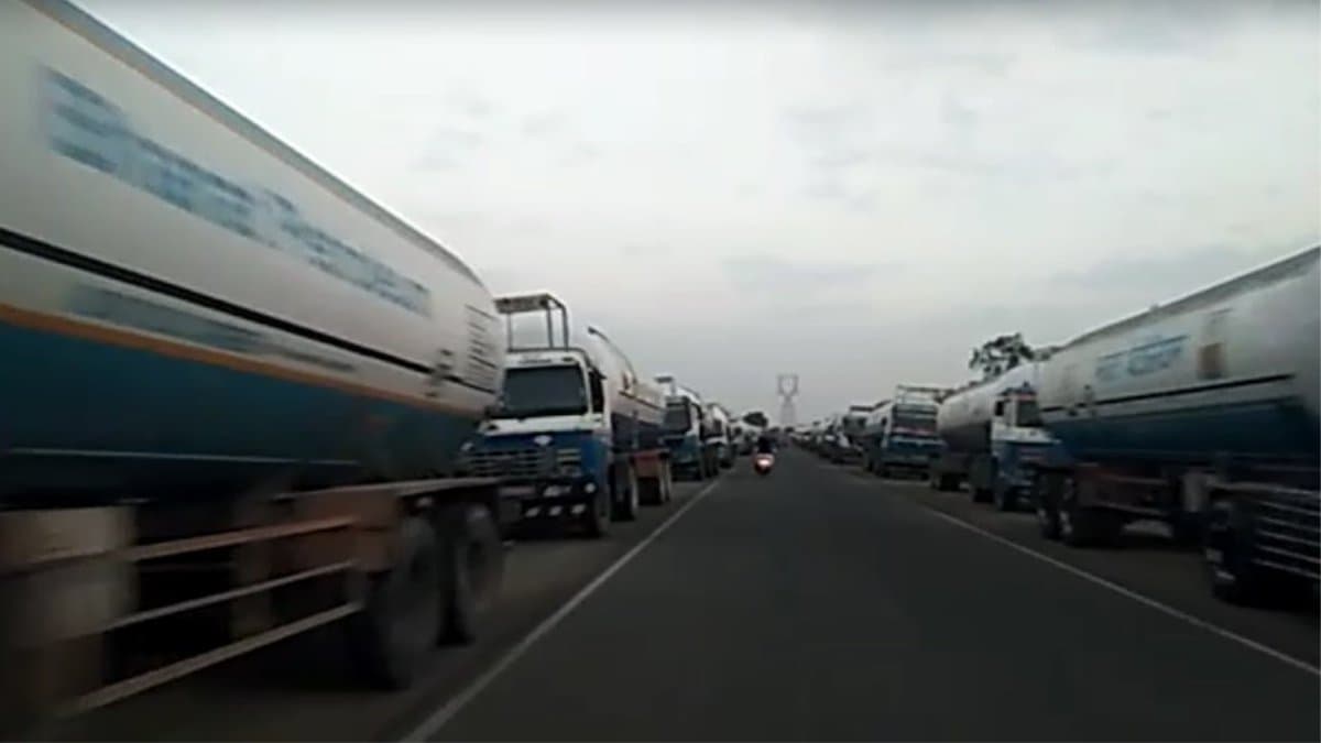 Tankers are parked on both sides of the road,