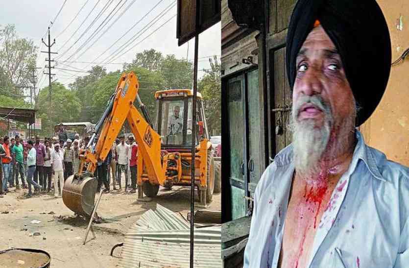Two shopkeepers fight during encroachment remove in alwar Video : अतिक्रमण हटाते समय दो दुकानदार भिड़े, एक का सिर फूटा तो दूसरे ने की जमकर धुनाई