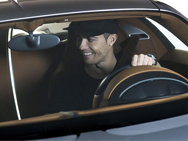 Cristiano Ronaldo drives his new Bugatti Chiron with Cristiano JR