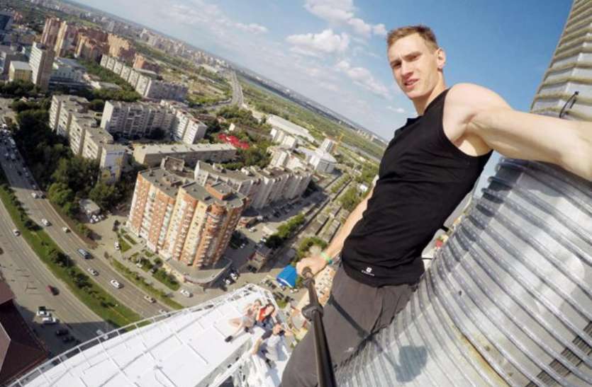 russian spiderman arrested in colombia after climbing 12 floors कोलंबिया: दस मिनट में 12 मंजिली इमारत चढ़ा 'रूस का स्पाइडरमैन' , छत पर पहुंचते ही गिरफ्तार