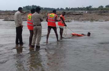 Rescue operation continues Young man in water Swimmer Rescue operation continues Young man in water Swimmer