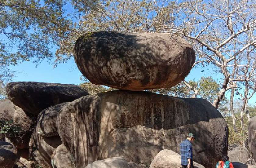 amazing balancing rock swinging in the air