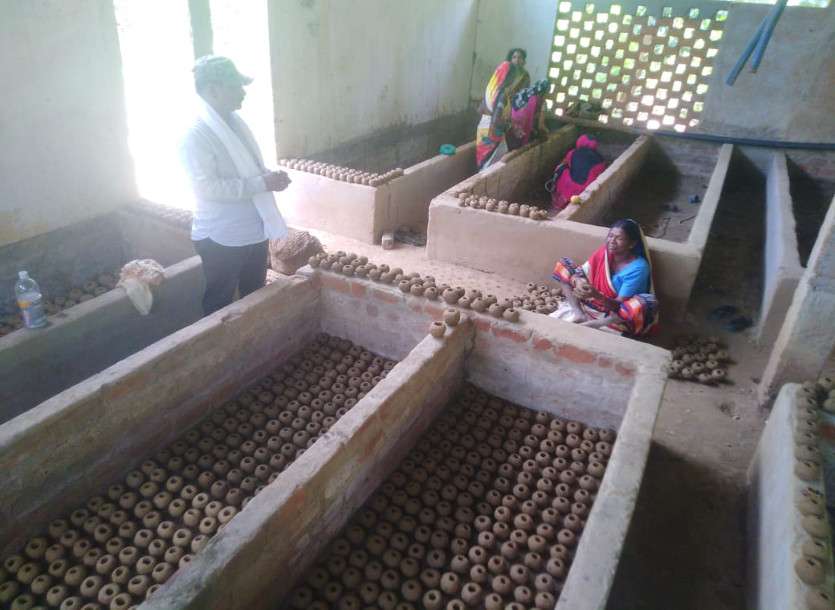 Women making seed ball