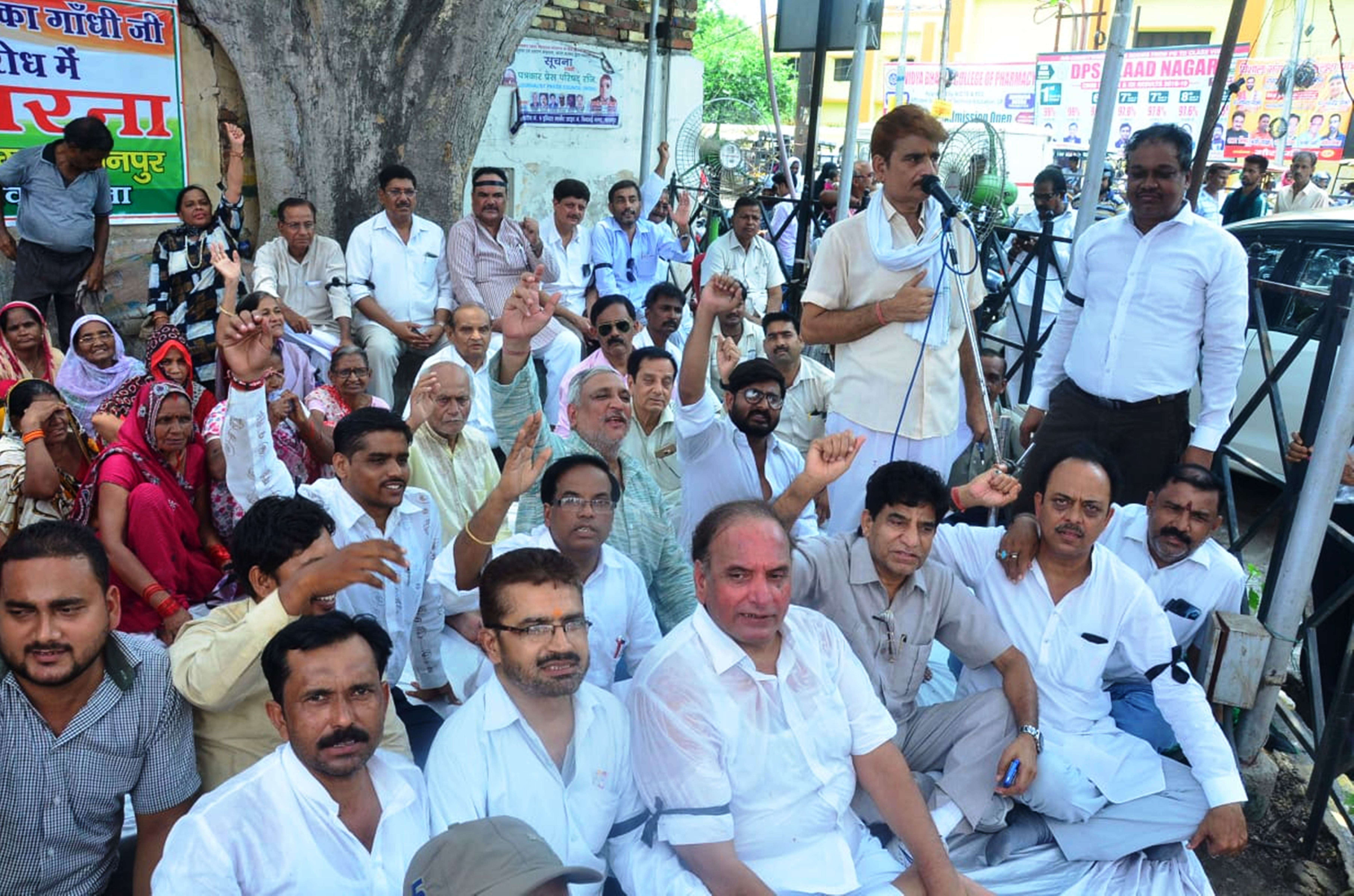 congress workers blow the effigy of up cm yogi adityanath