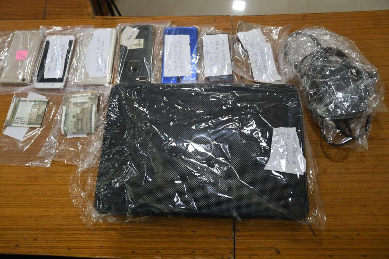 Six mobiles, a laptop, two bikes and cash seized