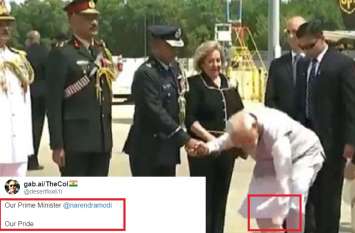PM Modi raised the flower that fell from the bouquet video goes viral अमेरिका की धरती पर गुलदस्ते से गिरे फूल को पीएम मोदी ने उठाया, लोगों ने दिए ये जबरदस्त रिएक्शन