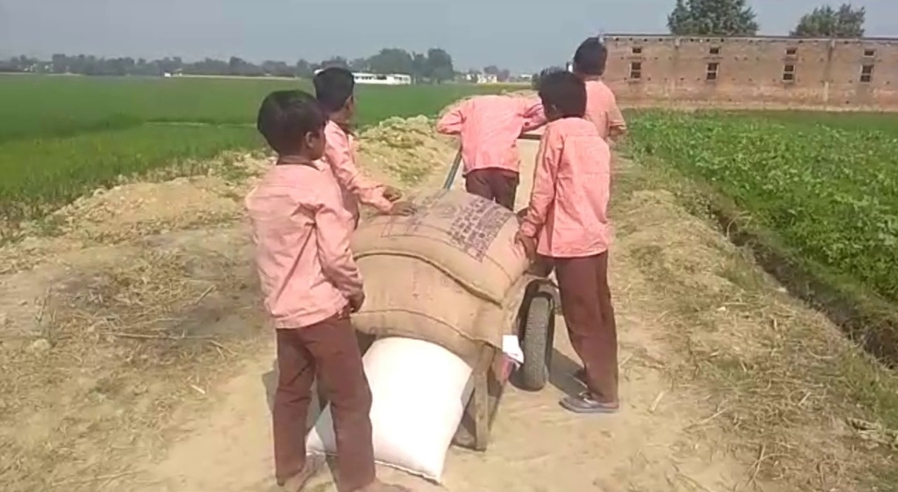 School children carried mid day meal ration on trolly