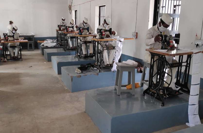 Prisoners making masks in jail.