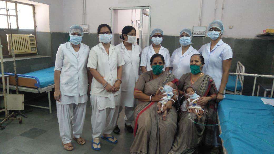 international mother's day : women feeding their milk to orphans