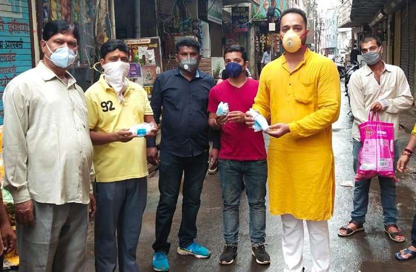 Youth distributing sanitizers.