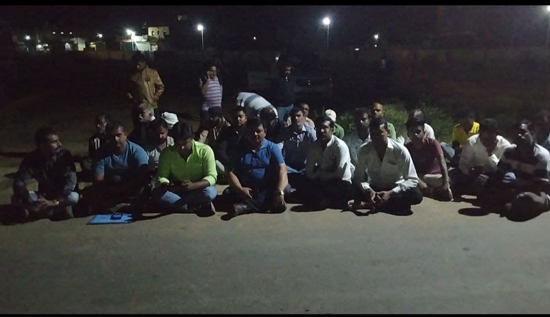 Truck Honors Association members sitting on dharna demanding action, p