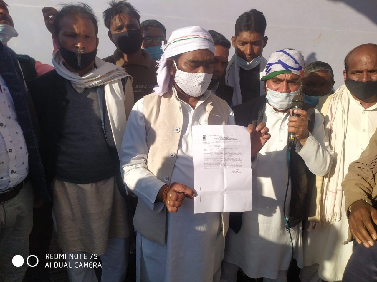 MLA sitting on middle road dharna in demand of construction of bad roa
