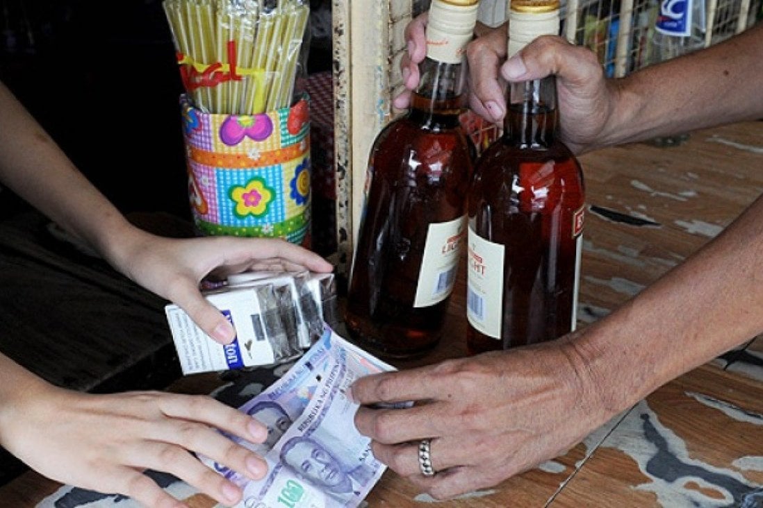 Symbolic Photo of Liquor and Money