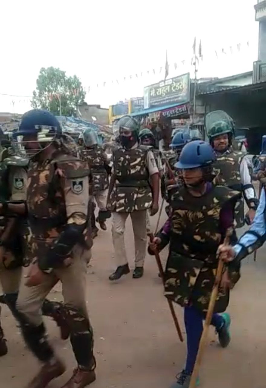 Before the festival, police and administrative officials did a flag ma