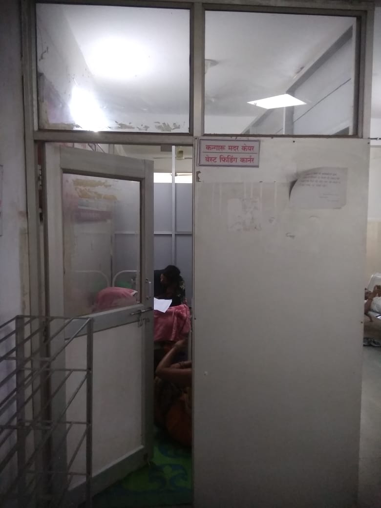 Where are the mothers feeding the newborns in the district hospital, p